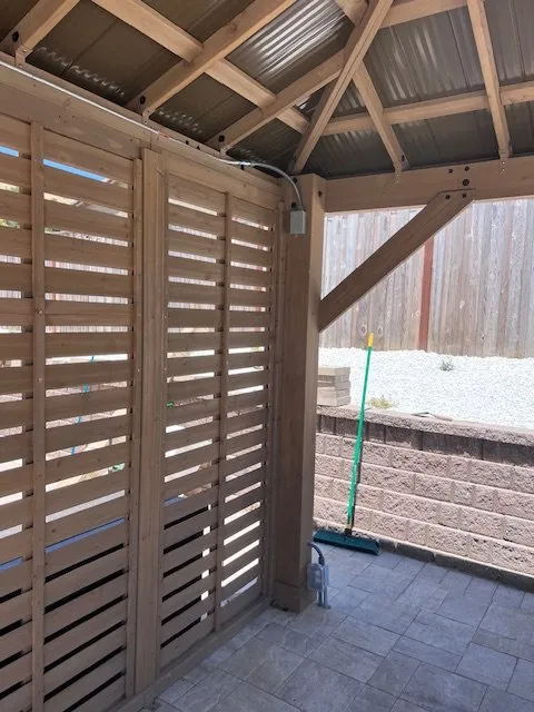 Finished conduit and boxes on the pergola frame