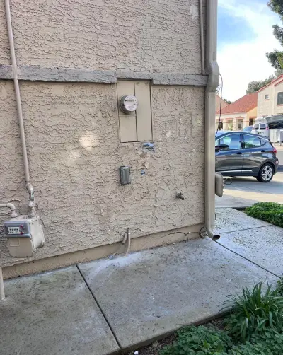 The same wall with the EV charger and outlet moved away from the meter